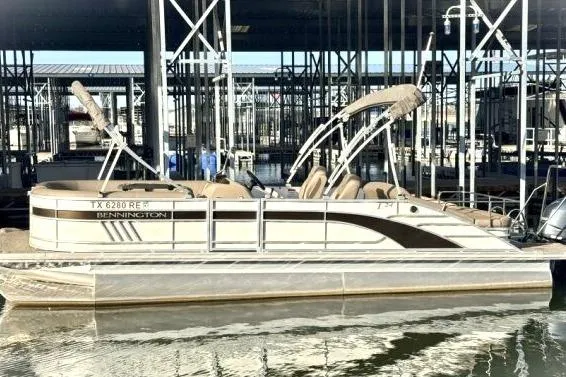 Slide: The Image of 2021 Bennington L 24 Swingback pontoon boat docked in marina. - 19