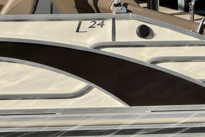 Slide: The Image of 2021 Bennington L 24 Swingback pontoon boat side view with sleek design details. - 20