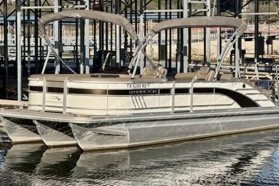 Slide: The Image of 2021 Bennington L 24 Swingback pontoon boat docked in marina. - 21