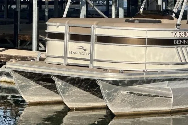 Slide: The Image of 2021 Bennington L 24 Swingback pontoon boat docked on calm water. - 22