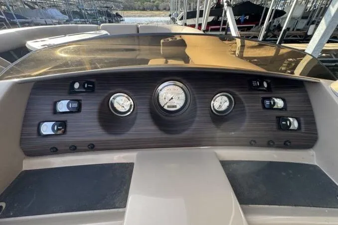 Slide: The Image of Dashboard of a 2021 Bennington L 24 Swingback boat with gauges and controls. - 5