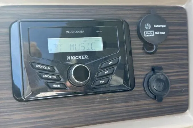 Slide: The Image of 2021 Bennington L 24 Swingback media center with Kicker audio system and input ports. - 7