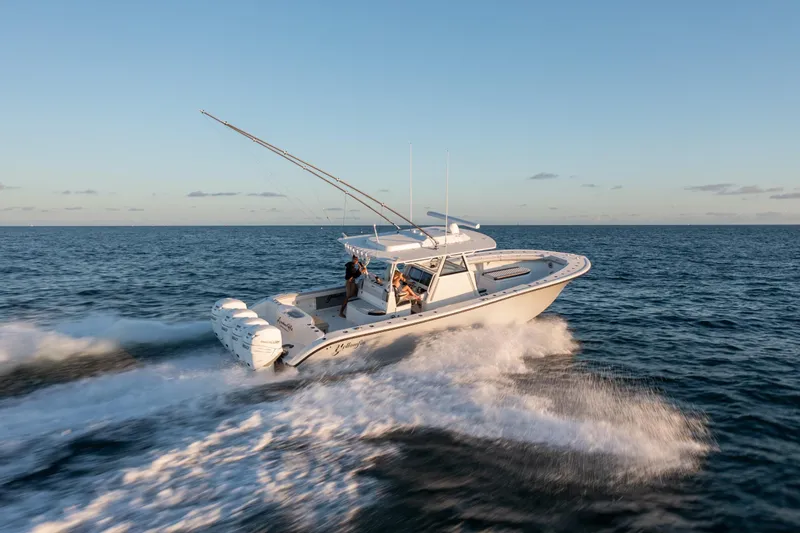 Slide: The Image of 2019 Yellowfin 39 boat cruising on open water. - 12
