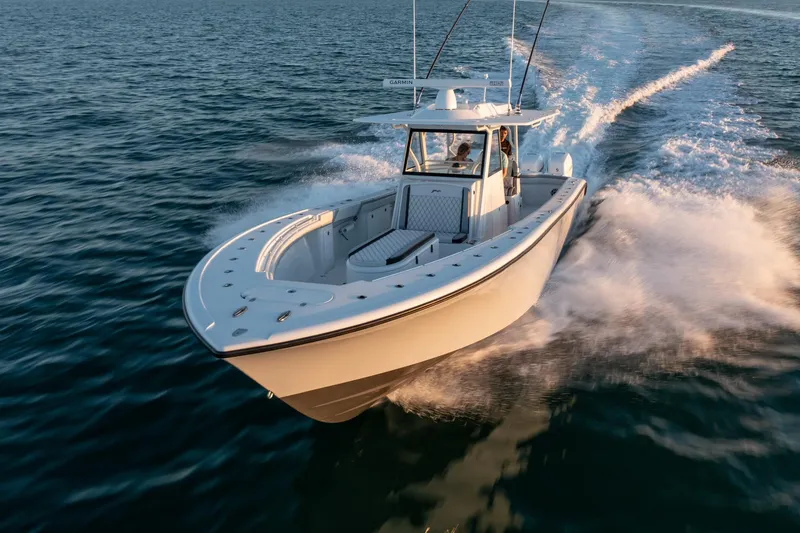 Slide: The Image of 2019 Yellowfin 39 boat cruising on open water. - 13