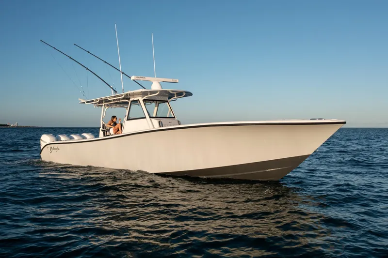 Slide: The Image of 2019 Yellowfin 39 boat cruising on open water. - 2