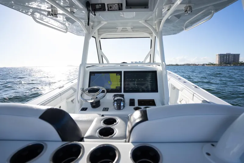 Slide: The Image of 2019 Yellowfin 39 boat helm with dual screens on open water. - 21