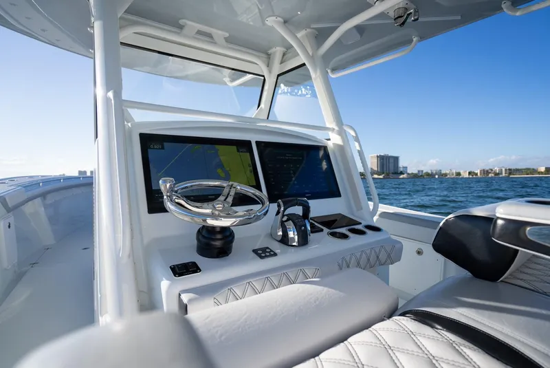 Slide: The Image of 2019 Yellowfin 39 boat cockpit with dual screens and steering wheel. - 22