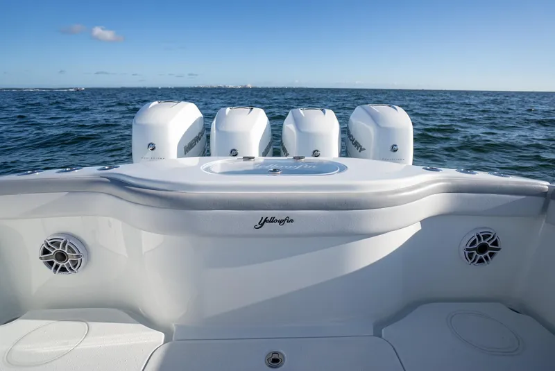 Slide: The Image of 2019 Yellowfin 39 boat with four outboard engines on open water. - 32