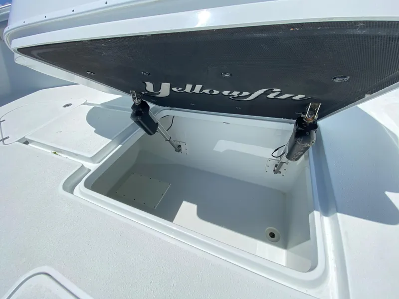 Slide: The Image of 2019 Yellowfin 39 boat storage compartment with open lid. - 47