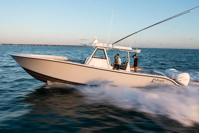 Slide: The Image of 2019 Yellowfin 39 boat cruising on open water. - 5