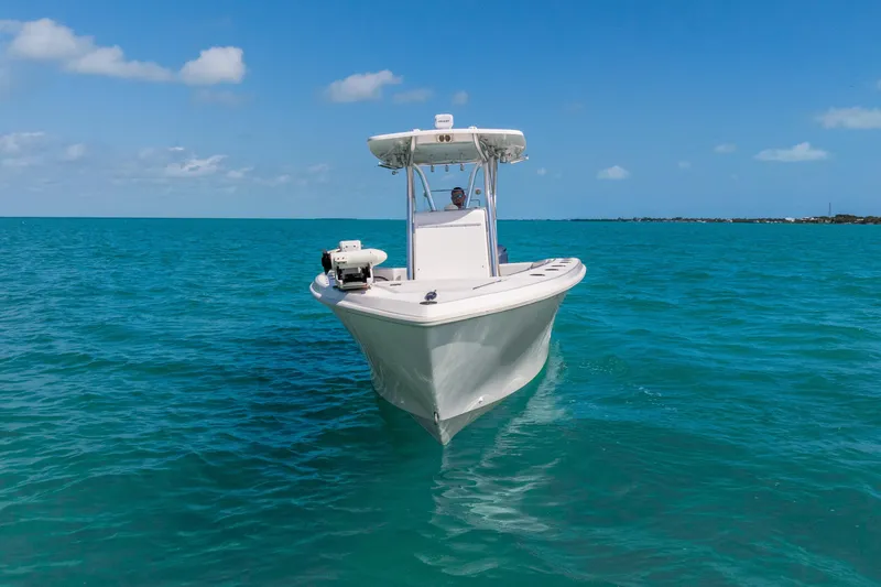 Slide: The Image of 2012 SeaHunter 29 boat cruising on clear blue ocean under sunny sky. - 15