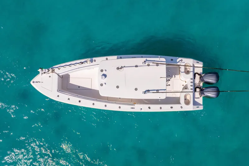 Slide: The Image of Aerial view of 2012 SeaHunter 29 boat on clear turquoise water. - 19