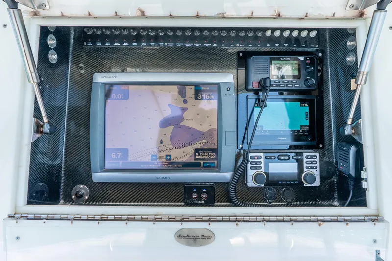 Slide: The Image of Control panel of a 2012 SeaHunter 29 boat with navigation and communication equipment. - 21