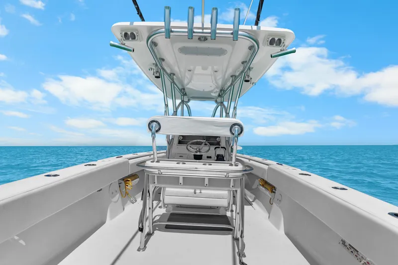 Slide: The Image of 2012 SeaHunter 29 boat interior with ocean view, clear sky, and fishing equipment. - 26