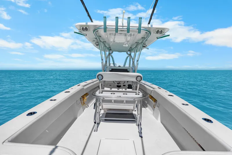 Slide: The Image of 2012 SeaHunter 29 boat on open ocean under clear blue sky. - 27