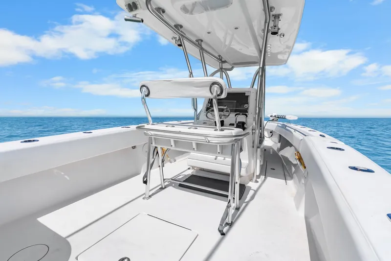 Slide: The Image of 2012 SeaHunter 29 boat interior with helm, ocean view, and clear sky. - 28