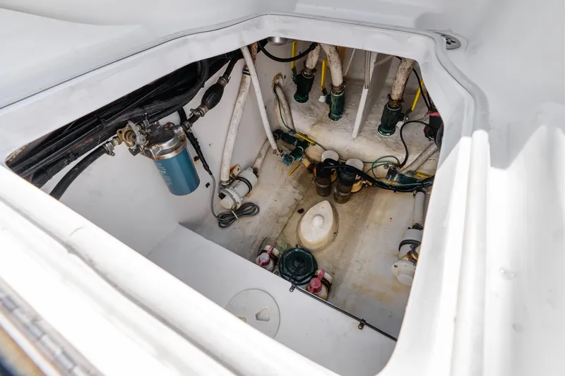Slide: The Image of 2012 SeaHunter 29 boat bilge area with visible plumbing and mechanical components. - 41
