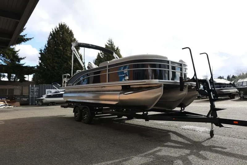 Slide: The Image of 2026 Harris Cruiser 210 SL pontoon boat on trailer in outdoor setting. - 11