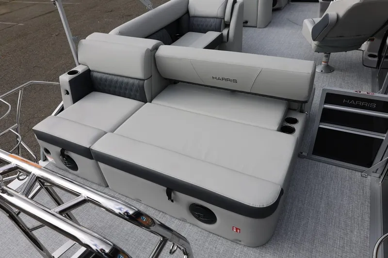 Slide: The Image of 2026 Harris Cruiser 210 SL pontoon boat interior with plush seating and cup holders. - 16