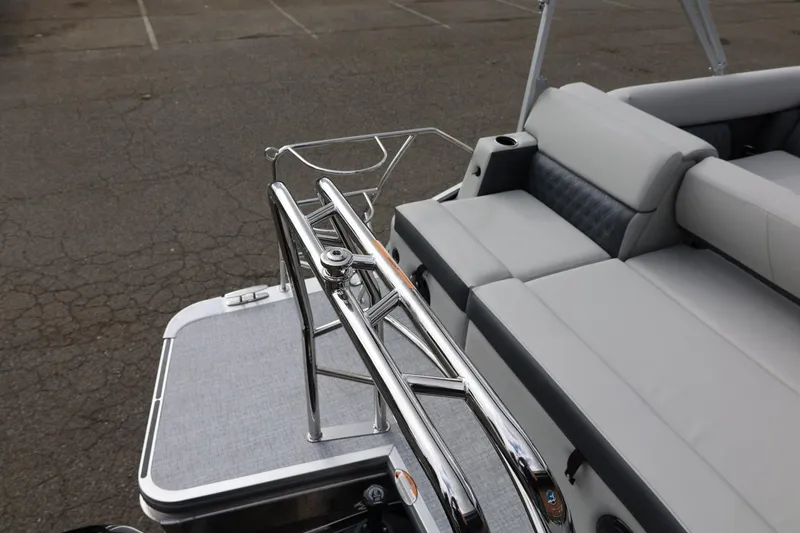 Slide: The Image of 2026 Harris Cruiser 210 SL boat interior with sleek seating and chrome details. - 17