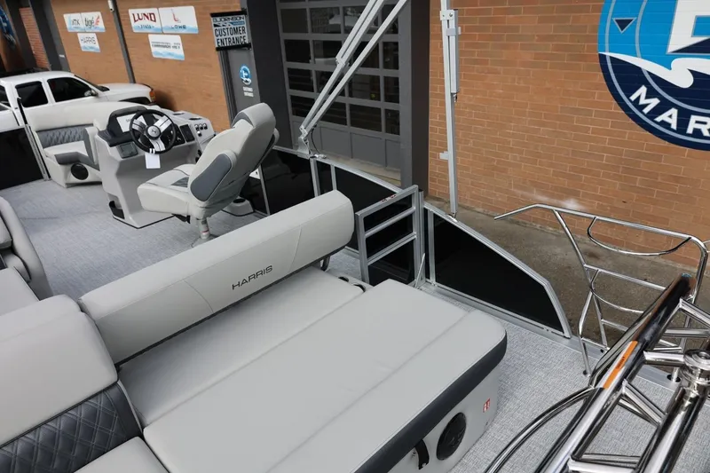 Slide: The Image of 2026 Harris Cruiser 210 SL pontoon boat interior with plush seating and modern helm. - 18