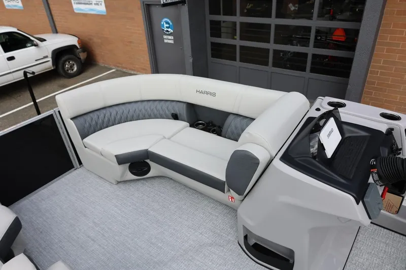 Slide: The Image of 2026 Harris Cruiser 210 SL boat interior with plush seating and modern console design. - 24