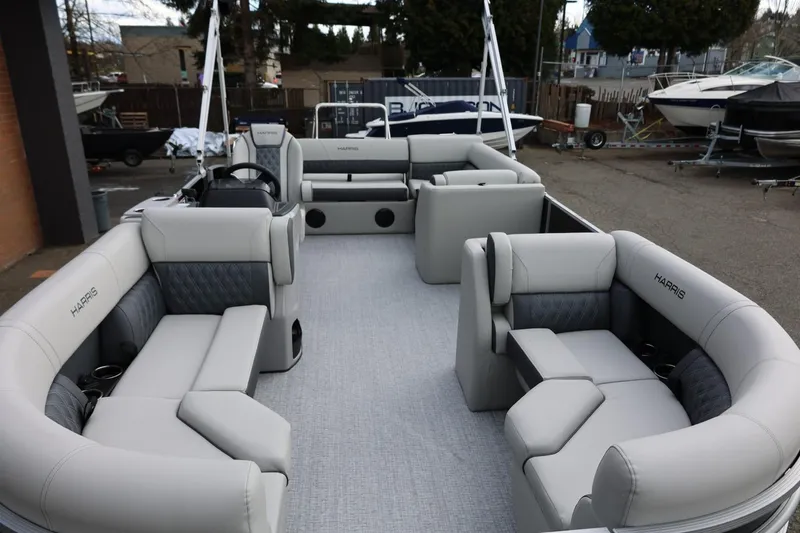 Slide: The Image of 2026 Harris Cruiser 210 SL pontoon boat with luxurious seating and modern design. - 27