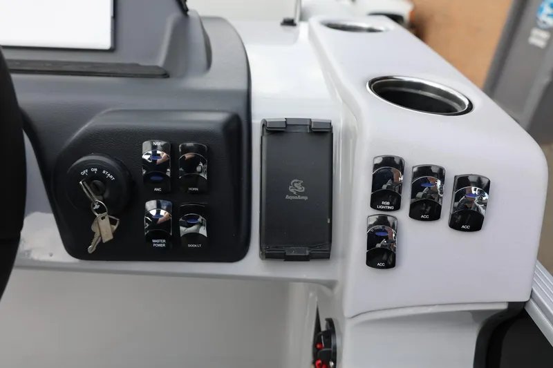 Slide: The Image of Control panel of 2026 Harris Cruiser 210 SL boat with switches and key ignition. - 29