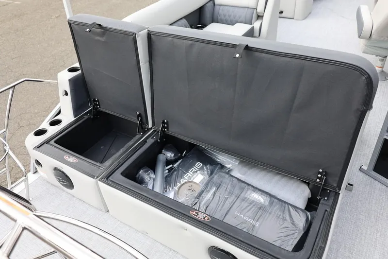 Slide: The Image of 2026 Harris Cruiser 210 SL boat storage compartments with accessories and seating. - 32