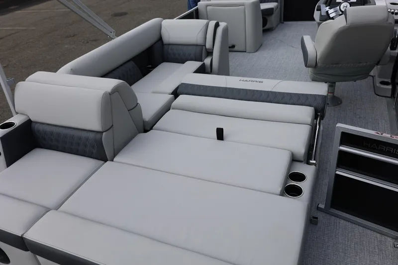 Slide: The Image of 2026 Harris Cruiser 210 SL boat interior with luxurious seating and cup holders. - 33