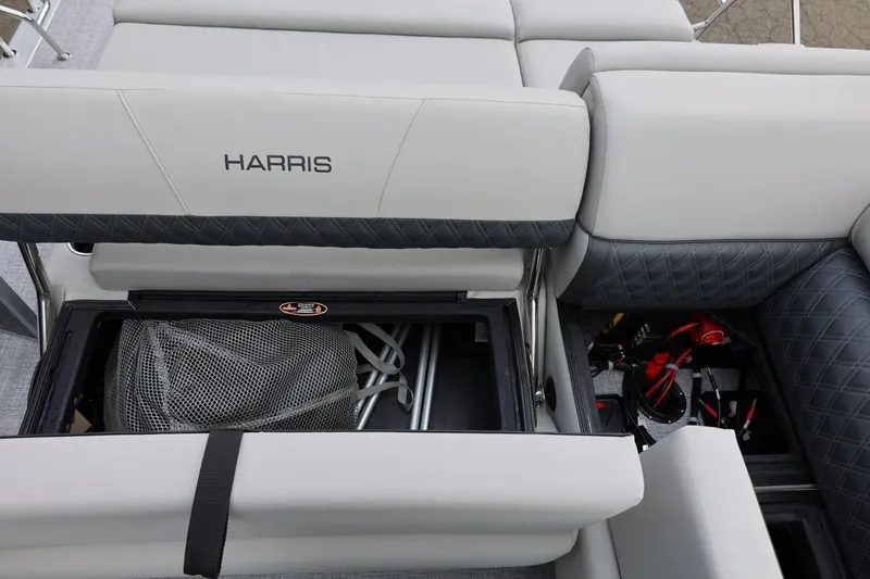 Slide: The Image of 2026 Harris Cruiser 210 SL boat interior with storage compartments and seating. - 34