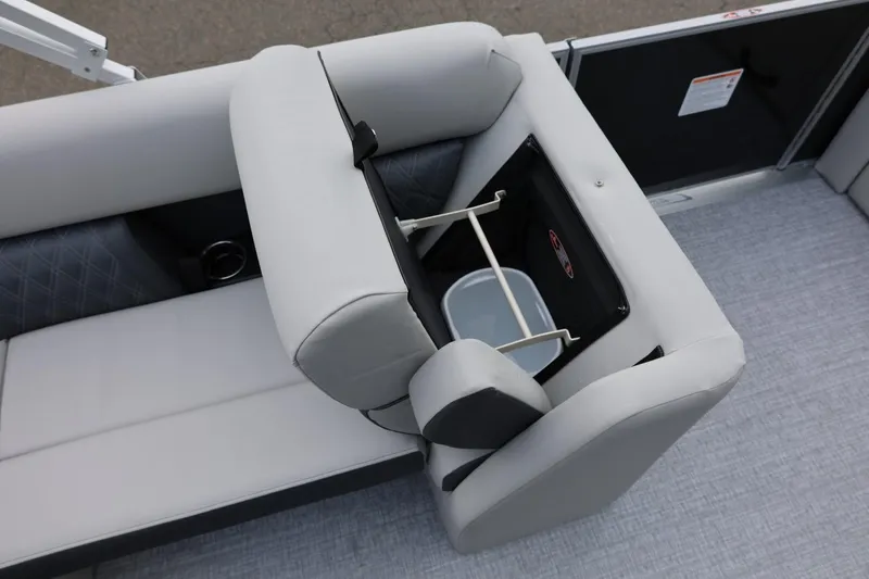 Slide: The Image of 2026 Harris Cruiser 210 SL boat interior with convertible seating and storage compartment. - 36