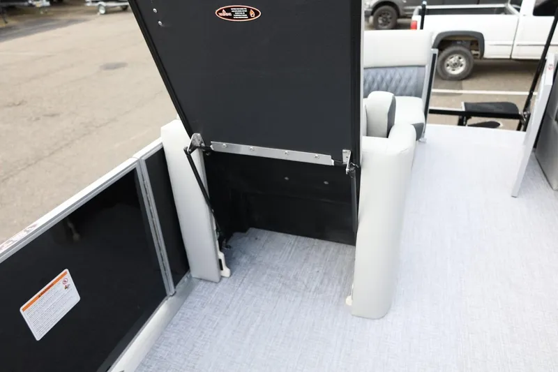 Slide: The Image of 2026 Harris Cruiser 210 SL boat interior with open storage compartment. - 38