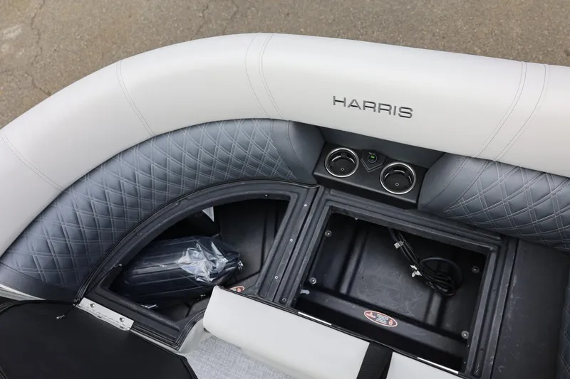 Slide: The Image of 2026 Harris Cruiser 210 SL boat interior with quilted seating and storage compartments. - 42