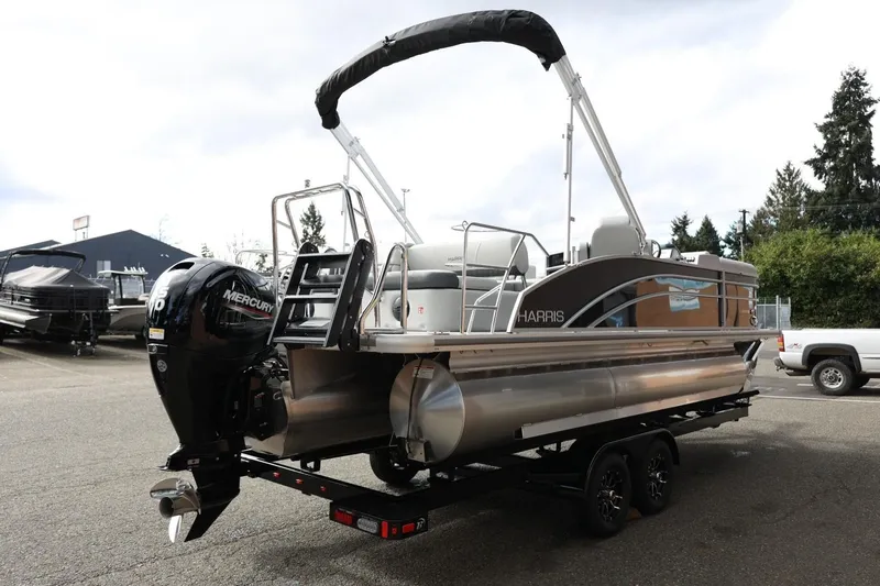 Slide: The Image of 2026 Harris Cruiser 210 SL pontoon boat with Mercury engine on trailer. - 7