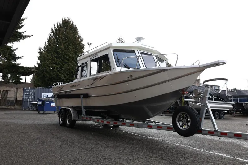 Slide: The Image of 2026 Thunder Jet 26 Alexis Pro XL boat on trailer in outdoor setting. - 10
