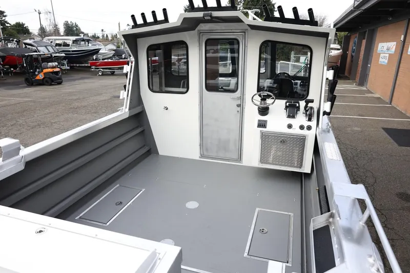 Slide: The Image of 2026 Thunder Jet 26 Alexis Pro XL boat interior with steering wheel and controls. - 15