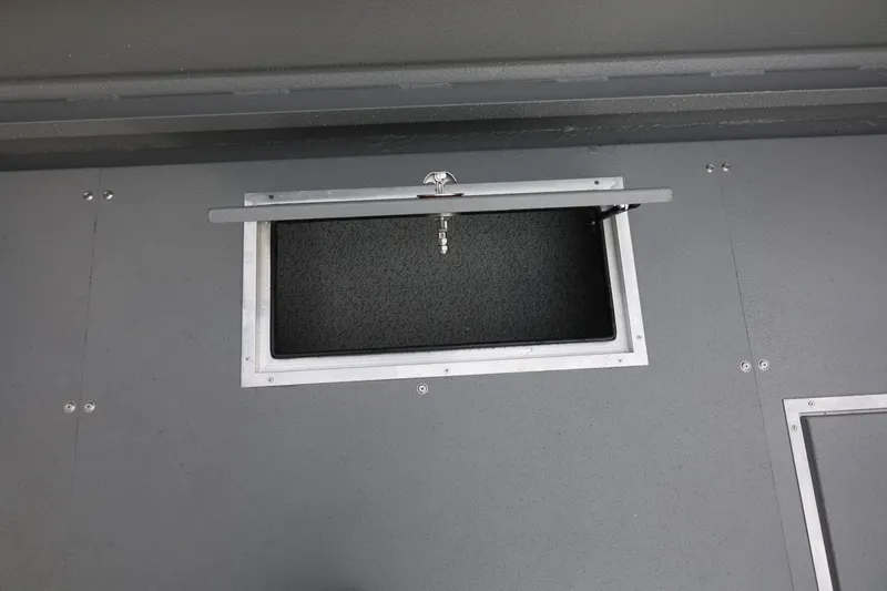 Slide: The Image of Open storage compartment on 2026 Thunder Jet 26 Alexis Pro XL boat. - 23
