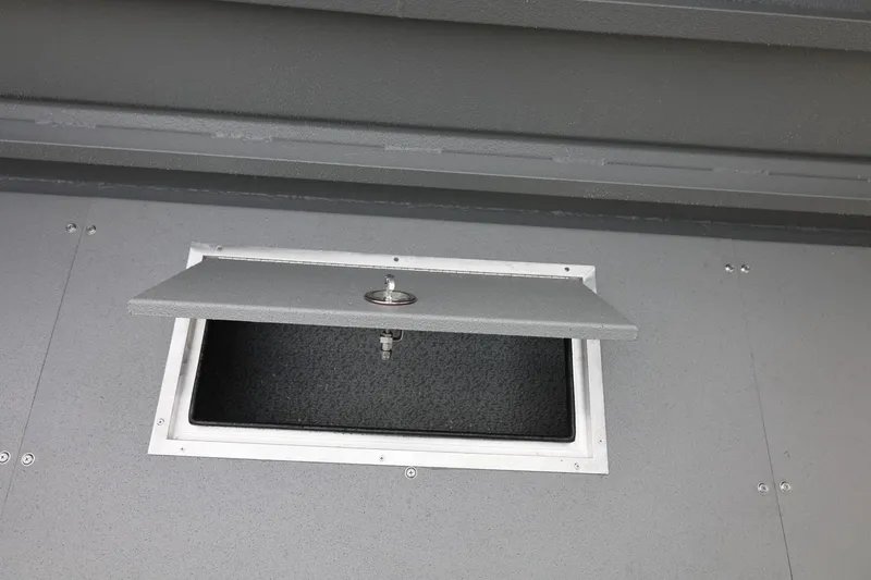 Slide: The Image of Open storage compartment on 2026 Thunder Jet 26 Alexis Pro XL boat. - 24