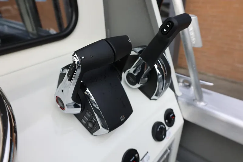 Slide: The Image of Throttle controls on 2026 Thunder Jet 26 Alexis Pro XL boat dashboard. - 26