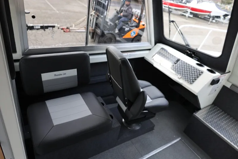 Slide: The Image of Interior of 2026 Thunder Jet 26 Alexis Pro XL boat with seating and dashboard. - 31