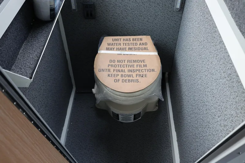 Slide: The Image of Thunder Jet 26 Alexis Pro XL 2026 boat toilet with protective film and inspection notice. - 33