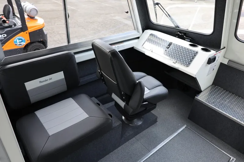 Slide: The Image of Interior of 2026 Thunder Jet 26 Alexis Pro XL boat with seating and control panel. - 34