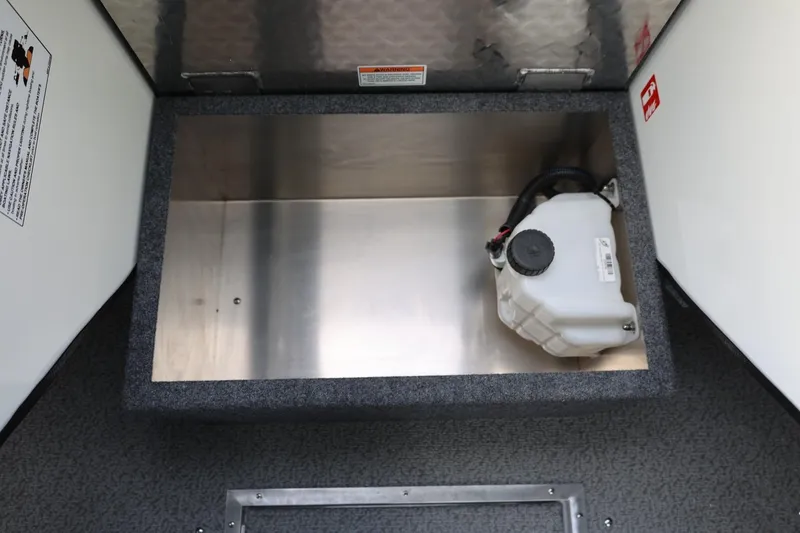 Slide: The Image of Storage compartment in 2026 Thunder Jet 26 Alexis Pro XL boat, featuring a white container. - 42