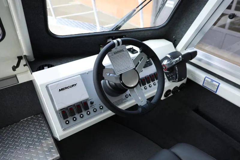 Slide: The Image of Interior of 2026 Thunder Jet 26 Alexis Pro XL boat with Mercury controls. - 43