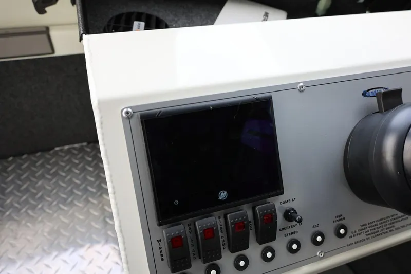 Slide: The Image of Control panel of 2026 Thunder Jet 26 Alexis Pro XL boat with switches and display. - 45