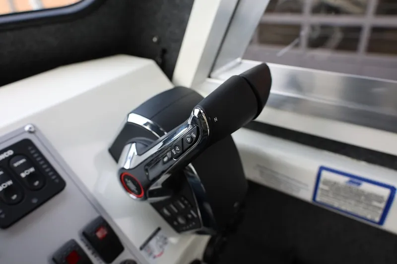 Slide: The Image of Control panel of 2026 Thunder Jet 26 Alexis Pro XL boat, featuring throttle lever. - 47