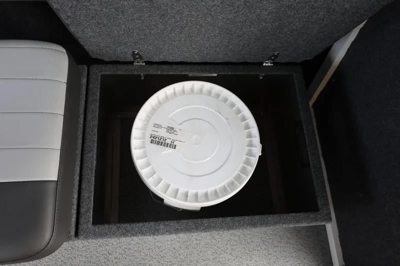 Slide: The Image of Storage compartment with a white bucket inside a 2026 Thunder Jet 26 Alexis Pro XL boat. - 51