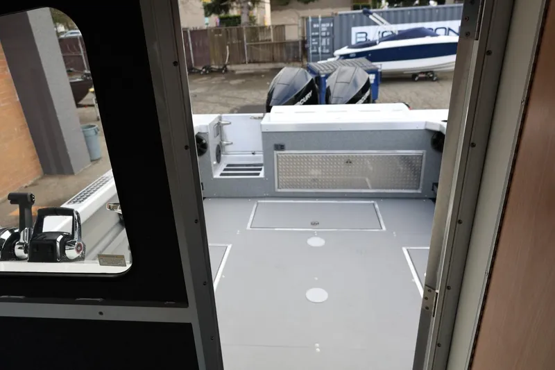 Slide: The Image of 2026 Thunder Jet 26 Alexis Pro XL boat interior with dual engines visible. - 52