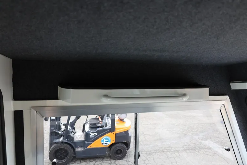 Slide: The Image of Interior view of 2026 Thunder Jet 26 Alexis Pro XL boat with window and ceiling details. - 54